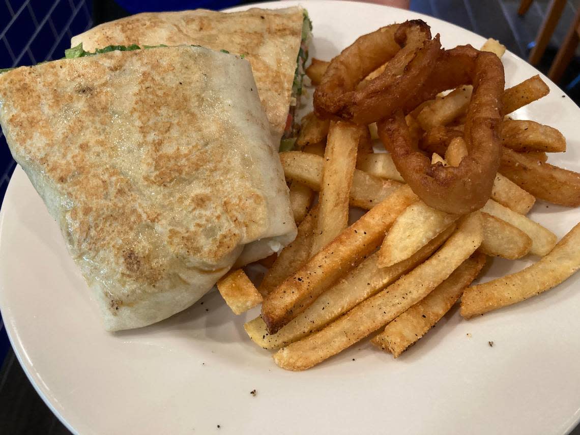 A wrap with fries and few onion rings on the side at Olympia Gyros at 670 Lake Joy Road, Suite 150, in Warner Robins.