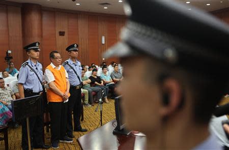 Yang Dacai, a former provincial official, listens to a verdict at a court in Xi'an, Shaanxi province, September 5, 2013. REUTERS/Stringer