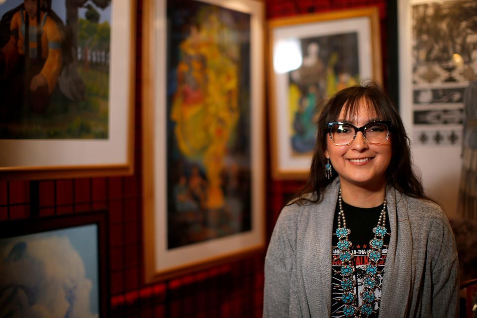 Shawnee-based Native American artist Amber DuBoise-Shepherd (Navajo, Sac & Fox and Prairie Band Potawatomi) poses for a photo by her booth during the 2021 Red Earth Festival. She will be one of the artists featured at the 2022 Cherokee Art Market in Tulsa.