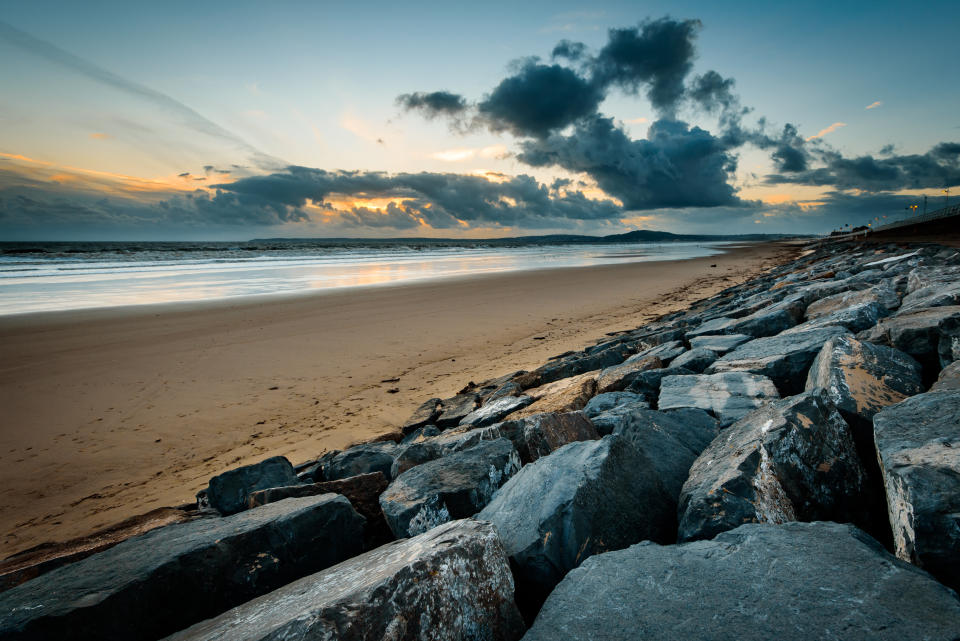 Storm clouds at sunset on Aberavon beach, Wales, UK