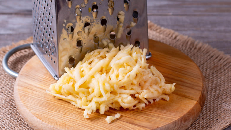 Grated apple on cutting board