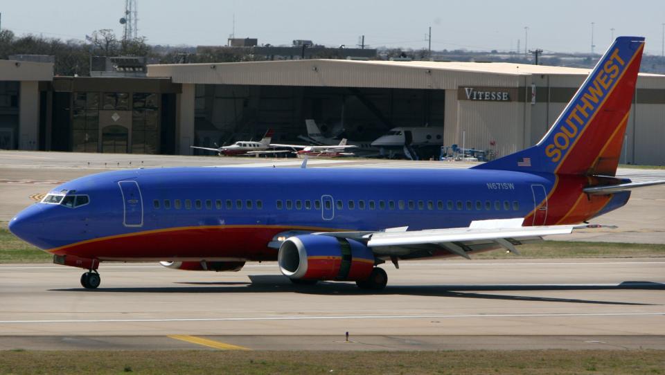 A Southwest Airlines plane taxis on the runway at airline's hub at Dallas Love Field March 12, 2008, in Dallas, Texas. (Photo by Rick Gershon/Getty Images)