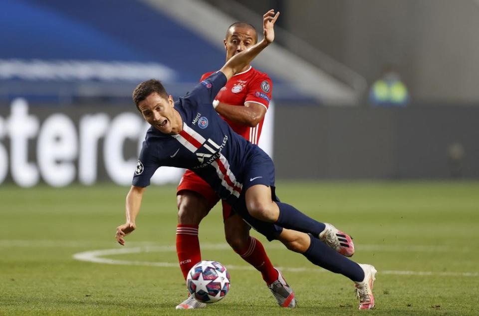 PSG’s Ander Herrera tumbles as he contests possession with Bayern’s Thiago Alcântara.