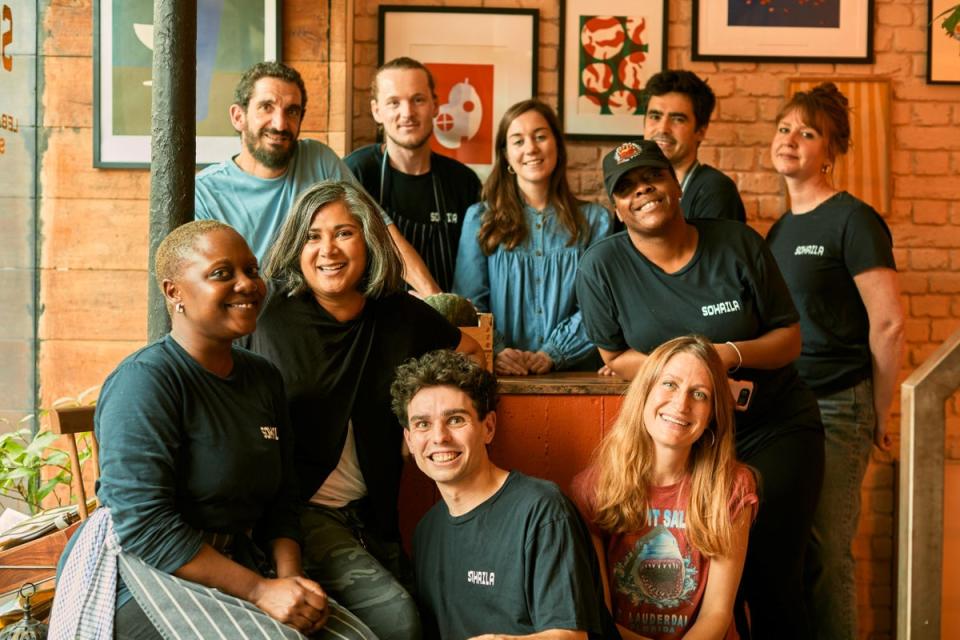 Some of the team, pictured with Meg Doherty (centre back, in denim) and Nathalie Moukarzel (front, right) (Harriet Langford)