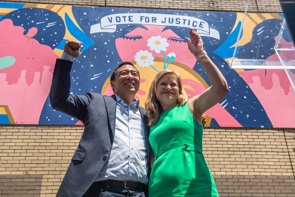 Mayoral candidates Andrew Yang and Kathryn Garcia wave to New Yorkers after speaking at the AAPI Democracy Project's "Voting is Justice Rally" in Chinatown on Sunday, June 20, 2021, in New York.