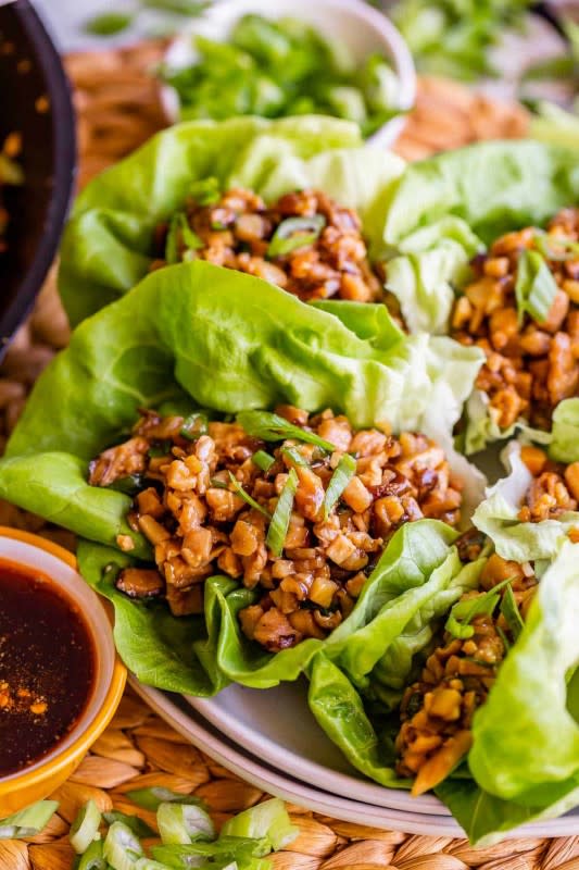 <p>The Food Charlatan</p><p>Finely diced chicken thighs are sautéed with shiitake mushrooms in a killer Asian-inspired sauce, then nestled into butter lettuce leaves and garnished with fried rice noodles.</p><p><strong>Get the recipe: <a href="https://thefoodcharlatan.com/pf-changs-lettuce-wraps/" rel="nofollow noopener" target="_blank" data-ylk="slk:PF Chang's Chicken Lettuce Wraps;elm:context_link;itc:0;sec:content-canvas" class="link rapid-noclick-resp">PF Chang's Chicken Lettuce Wraps</a></strong></p>