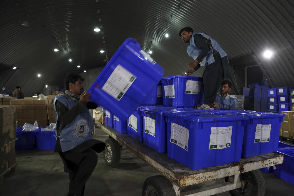 Election commission workers move ballot boxes in preparation for the presidential election scheduled for Sept 28, at the Independent Election Commission compound in Kabul, Afghanistan, Sunday, Sept. 15, 2019. Afghan officials say around 100,000 members of the country's security forces are ready for polling day. (AP Photo/Rahmat Gul)