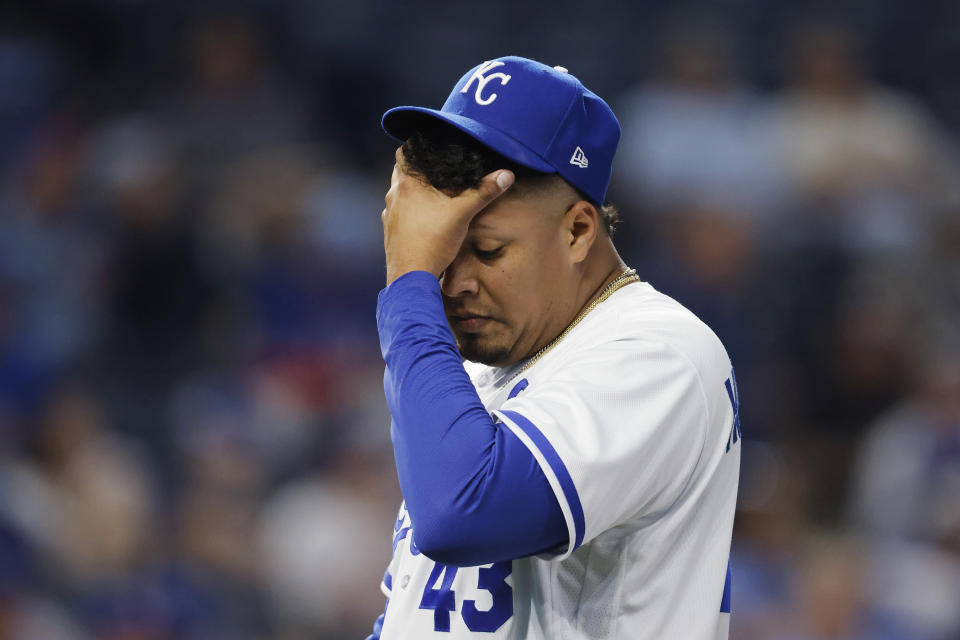 Kansas City Royals relief pitcher Carlos Hernandez reacts as he walks to the dugout after he is taken out of the game following a three-run homerun by Texas Rangers' Marcus Semien during the sixth inning of a baseball game in Kansas City, Mo., Tuesday, April 18, 2023. (AP Photo/Colin E. Braley)