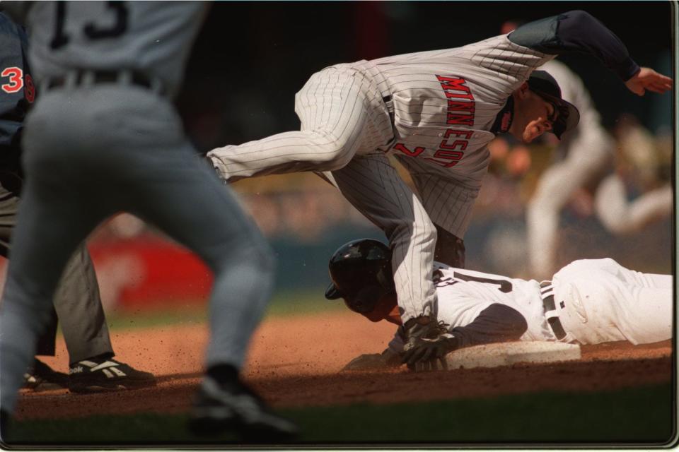 Third baseman Chris Hocking of the Minnesota Twins  commits an error while attempting to tag  Damion Easley in the eighth inning on April 7, 1997.  Easley stole second and was attempting to steal third when this error occurred.