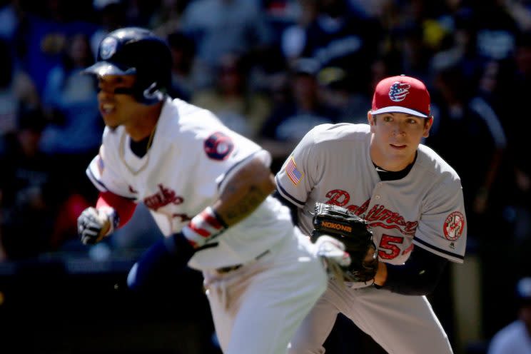 Orlando Arcia (left) in the middle of a rundown with the Orioles. (Getty Images)