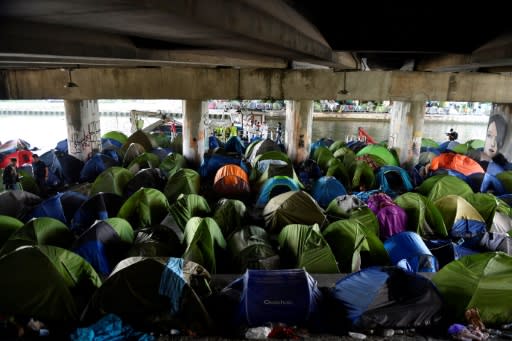 Security forces cleared the biggest migrant camp in the French capital where 1,700 people lived in makeshift tents alongside a canal
