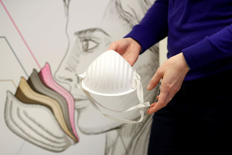 A worker holds a respirator containing a nanofibrous layer at the Pardam nanotechnology factory in Roudnice nad Labem