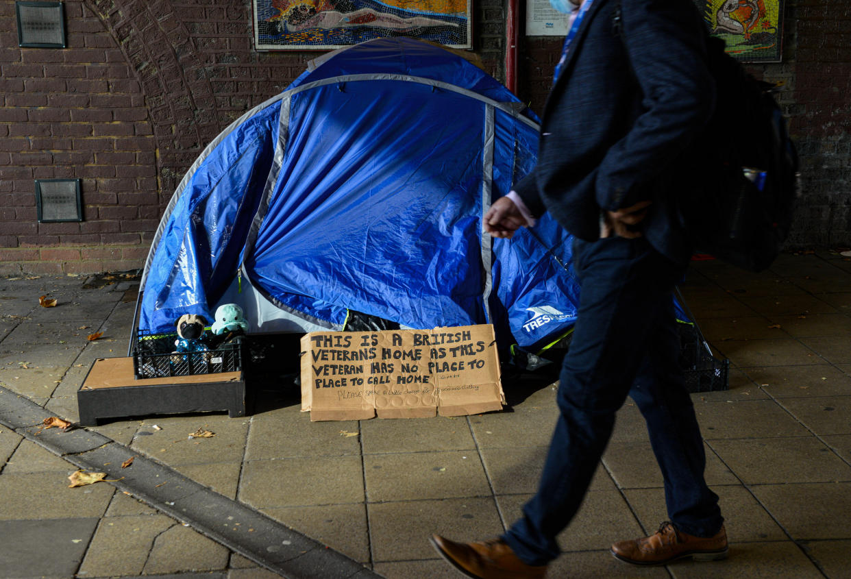 A man walks past a rough sleeper's tent in Tenison Way at Waterloo, London. (Photo by Thomas Krych / SOPA Images/Sipa USA)