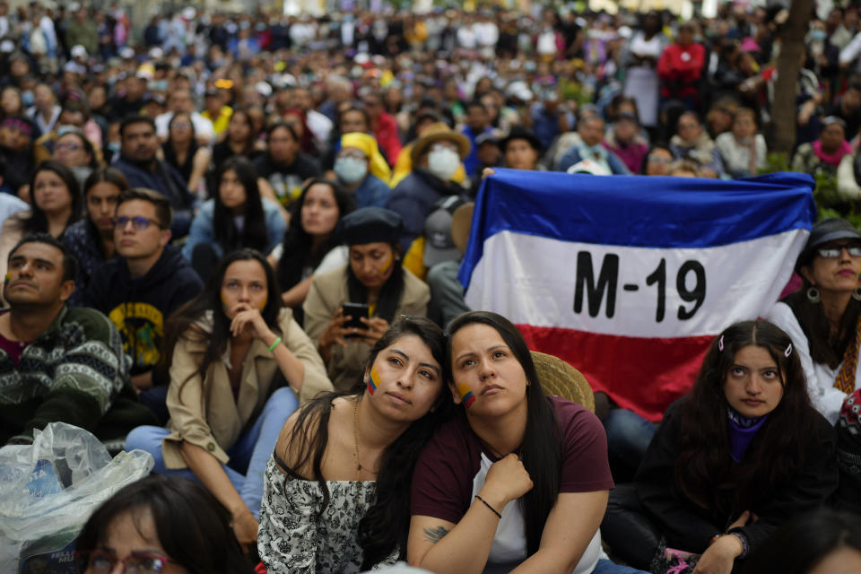 Supporters of new President Gustavo Petro attend his swearing-in ceremony at the Bolivar square in Bogota, Colombia, Sunday, Aug. 7, 2022. (AP Photo/Ariana Cubillos)