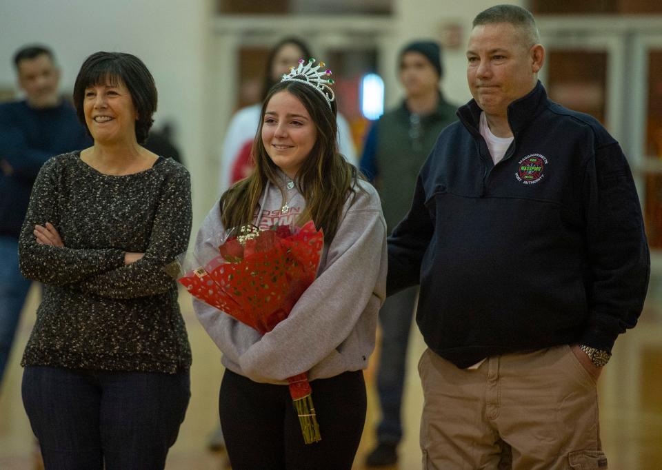 Hudson High School senior manager Jessica McDonald and family on Senior Night, Feb. 10, 2023.