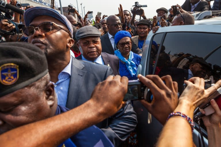Etienne Tshisekedi (C), an opposition leader in DR Congo, is surrounded by journalists as he arrives in Kinshasa on July 27, 2016