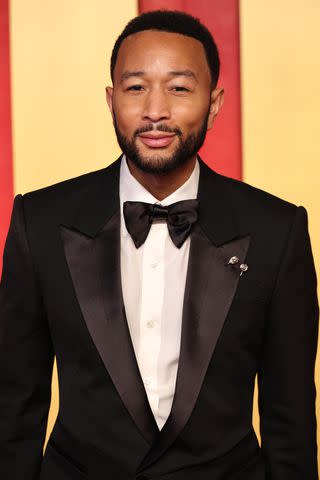 <p>Amy Sussman/Getty</p> John Legend attends the Vanity Fair Oscar Party in Beverly Hills in March 2024