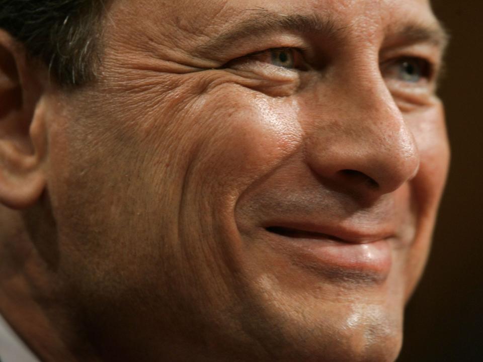 Chief Justice nominee John Roberts smiles while testifying on Capitol Hill in Washington, Tuesday, Sept. 13, 2005, at his confirmation hearing before the Senate Judiciary Committee.