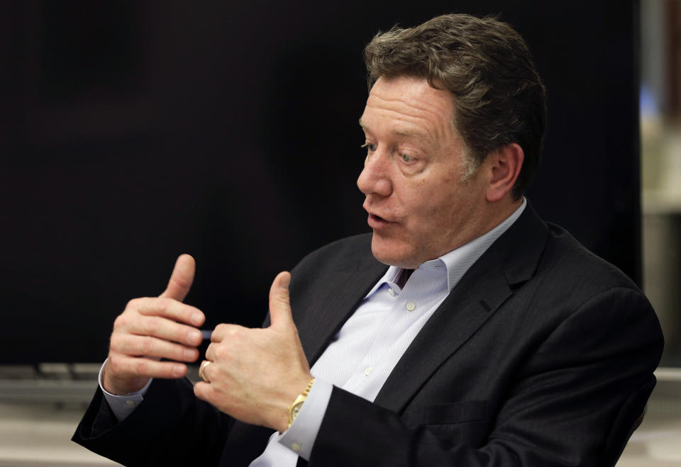 In this Thursday, May 1, 2014 photo, Domino's Pizza CEO Patrick Doyle answers questions during an interview in New York. After having been plagued with a reputation for tasting generic and manufactured, the Ann Arbor, Mich.-based chain has been enjoying strong sales and growth overseas boasting nearly 6,000 international locations. (AP Photo/Julie Jacobson)