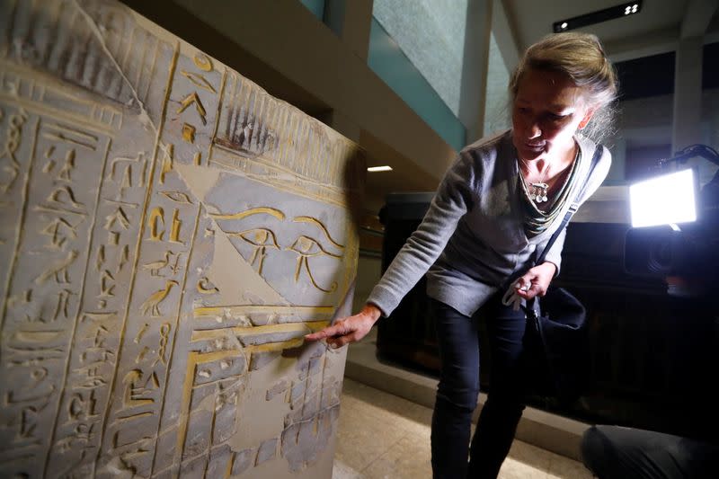 Friederike Seyfried, Director of the Egyptian Museum and Papyrus Collection shows damages, in Berlin