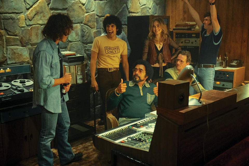 Standing, from left: Bandmates Claflin, Sebastian Chacon, Suki Waterhouse and Will Harrison with tour manager Tom Wright (seated, left) in a recording studio scene.