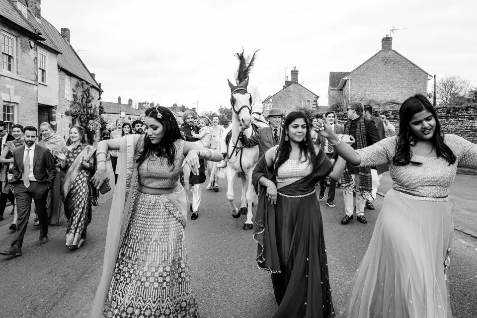 The beginning of the groom’s procession, known as the Baraat. My nieces and cousin are leading the way; everyone dances to the drummers and cheers the groom on. I secretly watched from a window in the manor, since the groom is not supposed to see the bride before the ceremony.