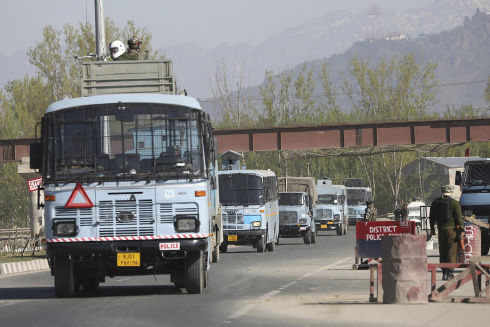 A convoy of Indian paramilitary soldiers moves on a highway on the outskirts of Srinagar, Indian controlled Kashmir, Sunday, Feb. 7, 2019. Authorities in Indian portion of Kashmir have banned civilian traffic on Srinagar-Jammu national highway for two days in a week for the safe passage of Indian security force convoys. The move comes after the February 14 suicide bombing on a paramilitary convoy which killed more than 40 paramilitary personnel. (AP Photo/Dar Yasin)