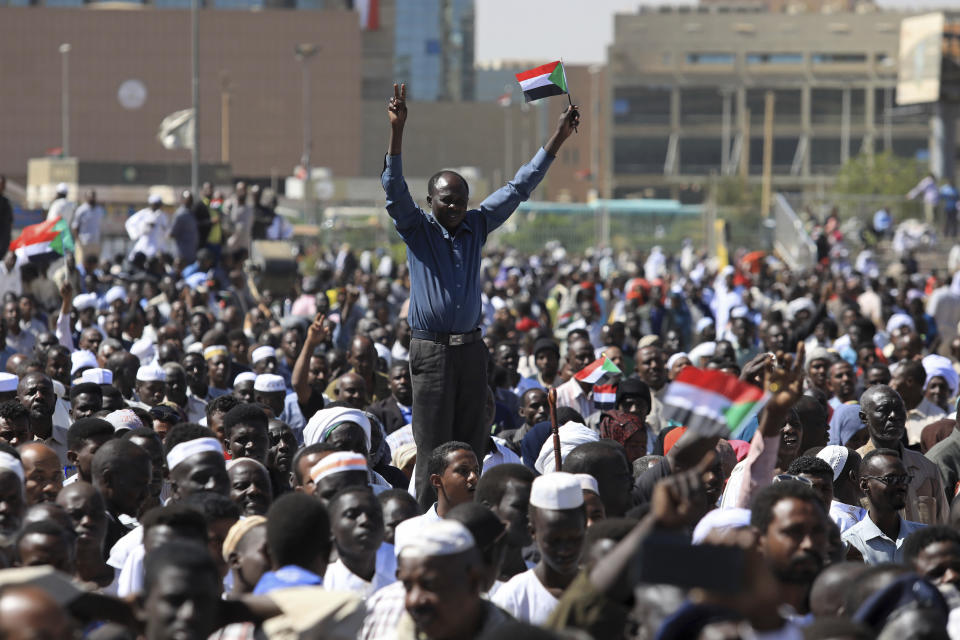 Supporters of Sudan’s President Omar al-Bashir attend a pro-government rally in Khartoum, Sudan, Wednesday, Jan. 9, 2019. Al-Bashir told the gathering of several thousands of supporters in the capital that he is ready to step down only “through election.” The remarks come after three weeks of anti-government protests. (AP Photo/Mahmoud Hjaj)
