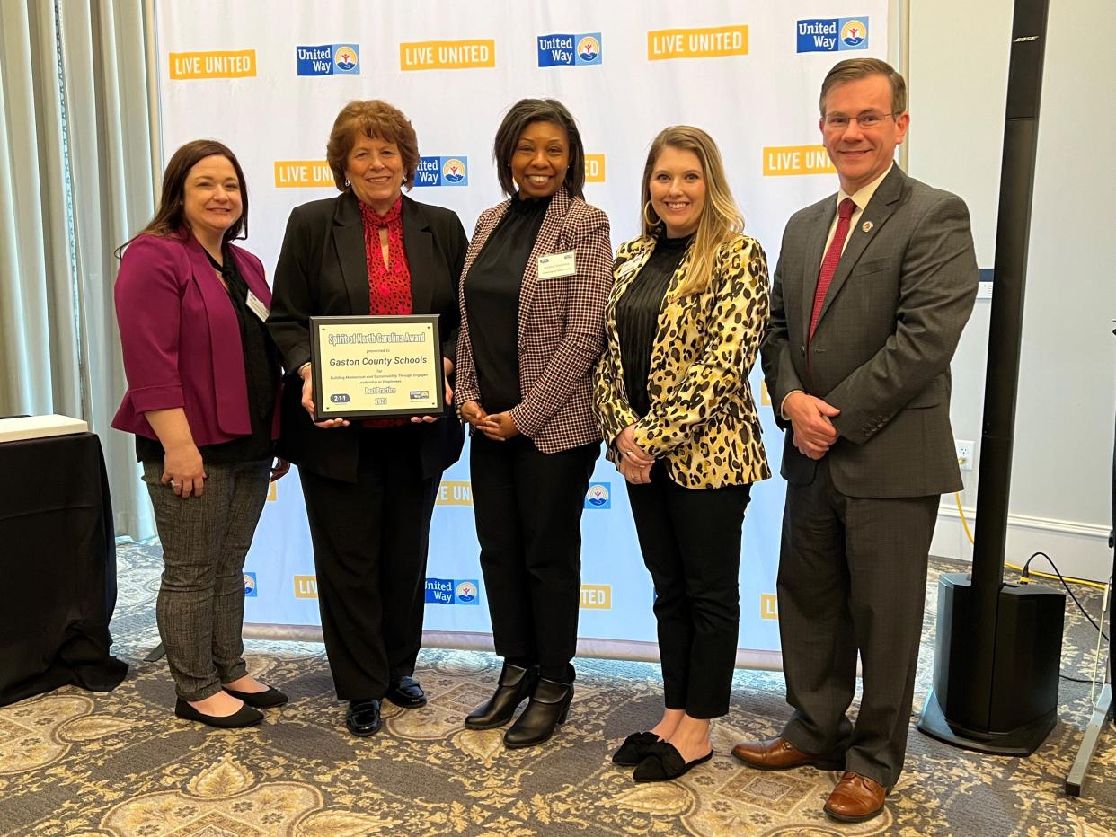 Gaston County Schools representatives stand with their award from the United Way of Gaston County.