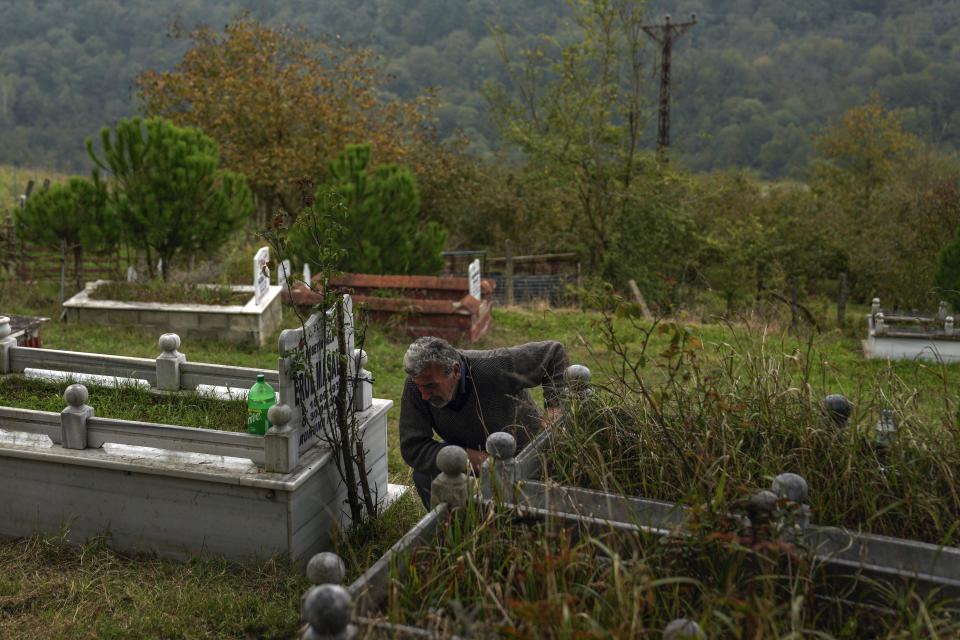 Recep Ayvaz, 62, father of the miner killed in a coal mine explosion Selcuk Ayvaz, 33, reacts after visiting the grave of his son in Amasra, in the Black Sea coastal province of Bartin, Turkey, Sunday, Oct. 16, 2022. (AP Photo/Khalil Hamra)