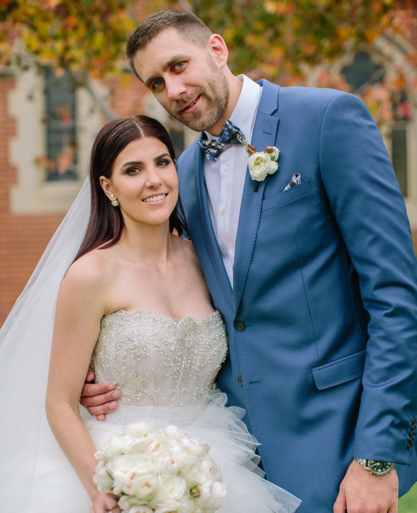 Wildcats player Tom Jervis and Jazze McNeil on their wedding day. Picture: Sarah Kate Dorman Photography