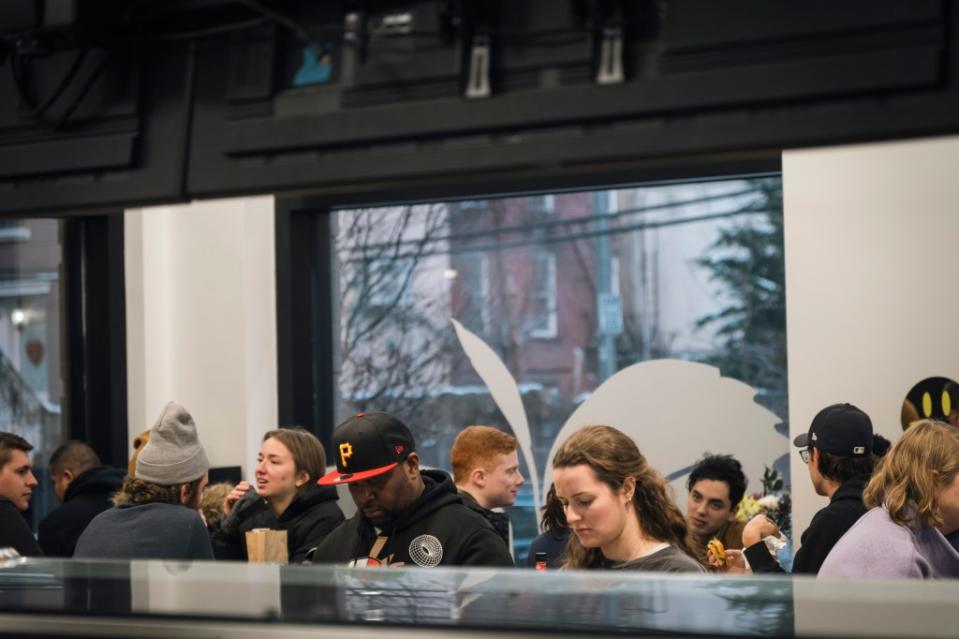 A line of customers wait for burgers on Saturday at Jubilee Marketplace’s 20 Gram Café in Greenpoint. Stefano Giovannini