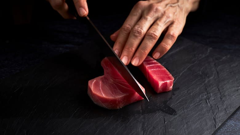Tuna steak being sliced