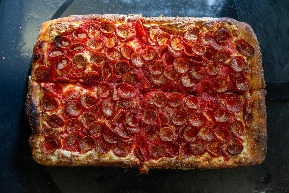 Owner Jason Enger of Red Bank prepares The Jersey Devil, an upside down Sicilian pizza with cup and char pepperoni and topped with Mike's Hot Honey at The Sauce Pizzeria in Oceanport, NJ Monday, January 22, 2024.