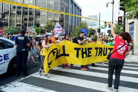 Climate change activists march through police tape in Washington