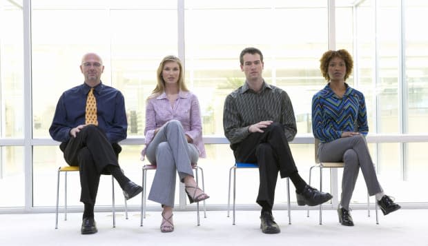 Businesspeople sitting in row