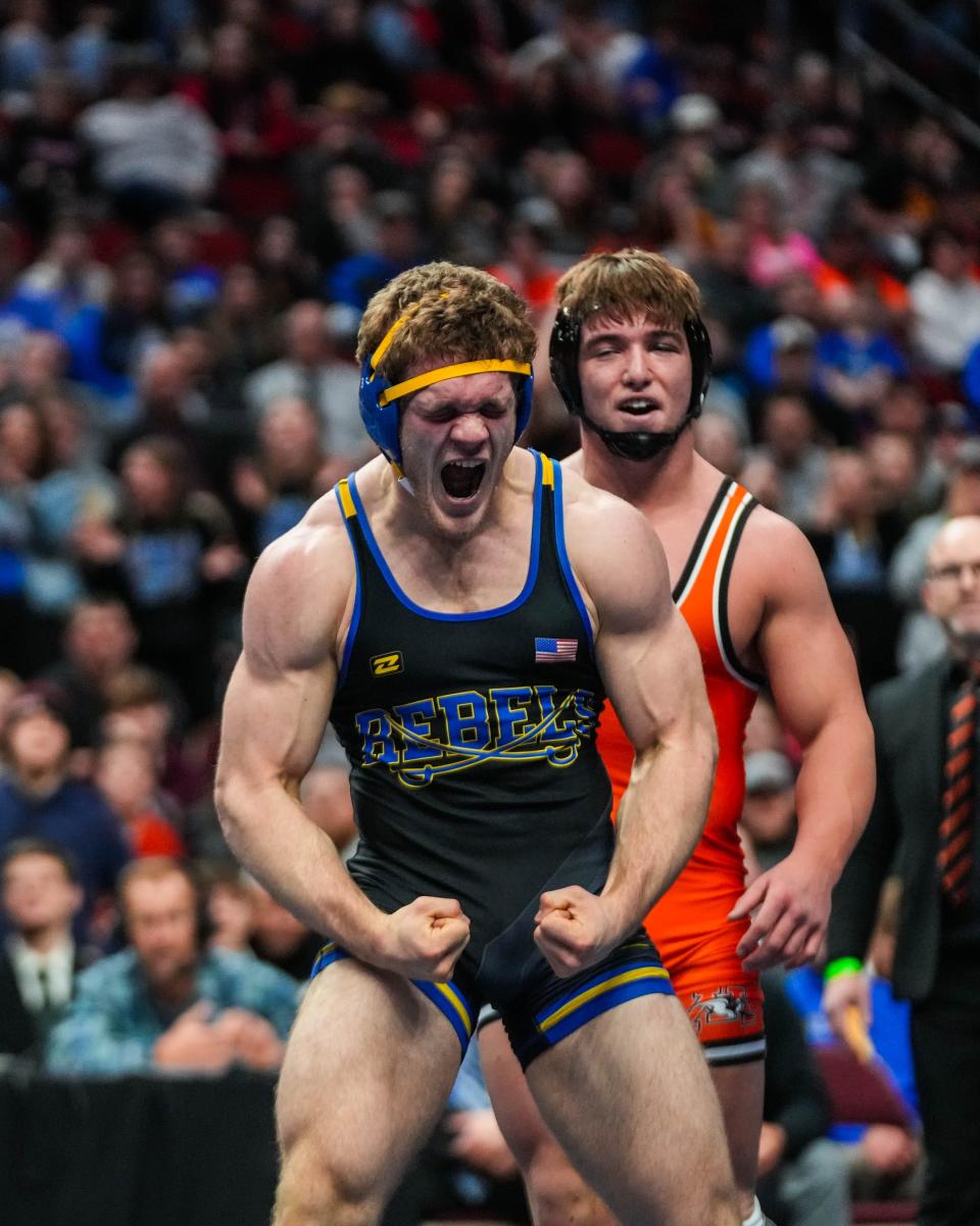 Mediapolis' Josh Glendening reacts to beating Westwood's Jackson Dewald at 195 pounds during the championship round of the Class 1A state wrestling tournament Saturday.