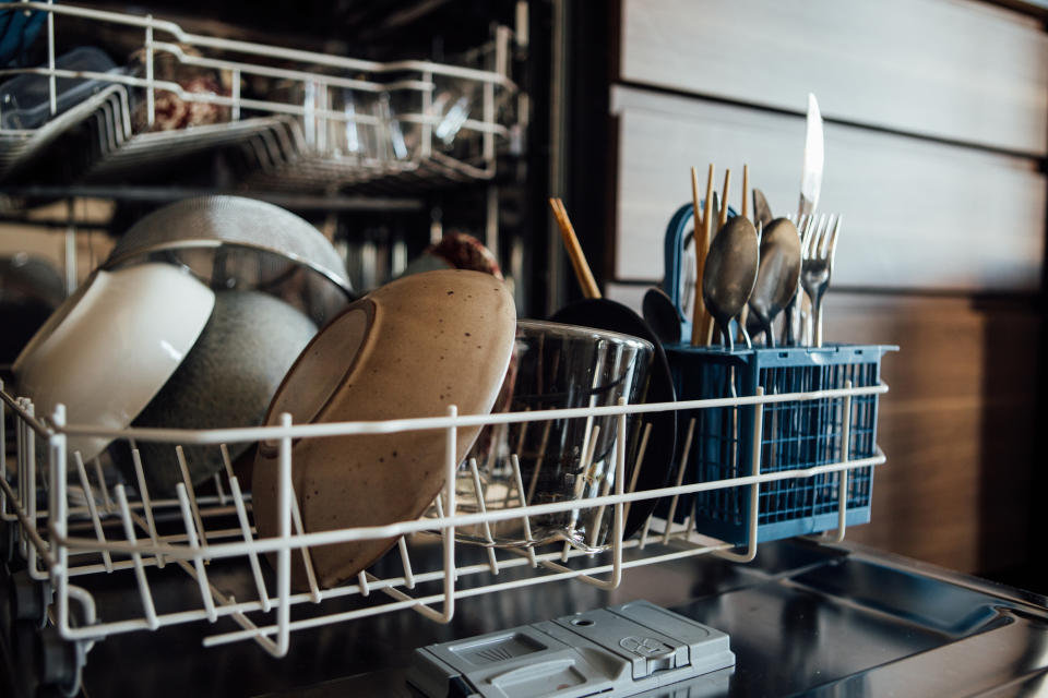 Stock picture of a dishwasher about to be unloaded. (Getty Images)