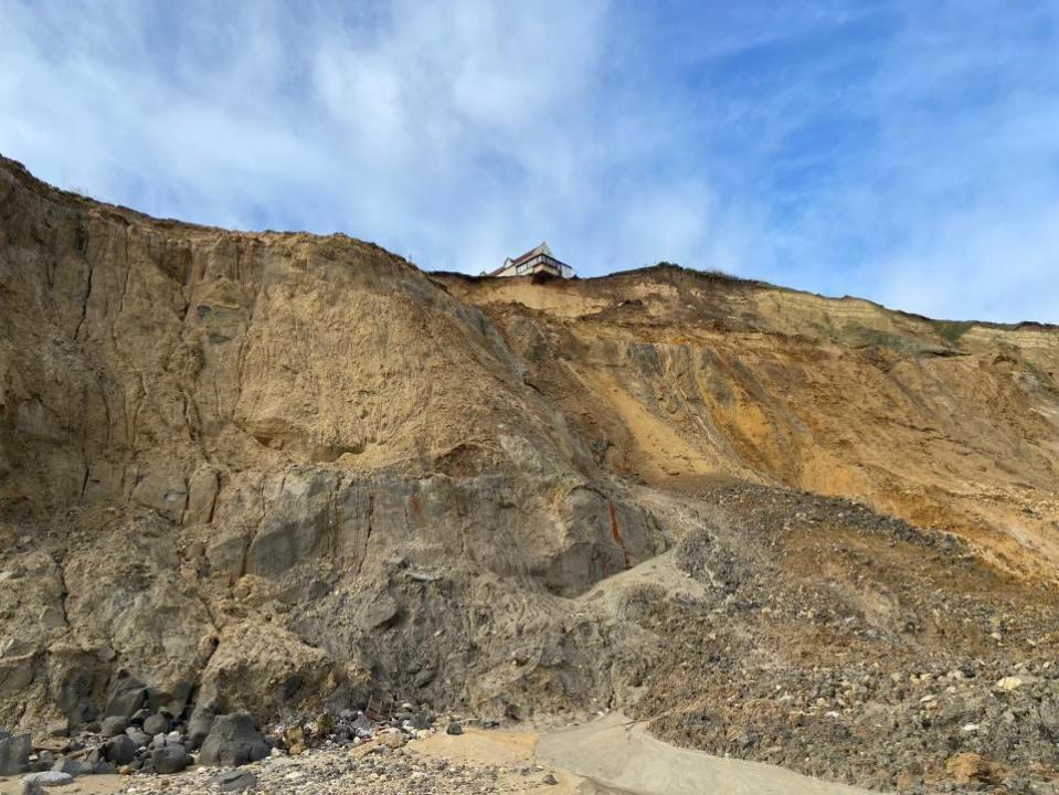 Eastern Daily Press: Two homes have been left hanging from a cliff after a chunk slipped away in Trimingham