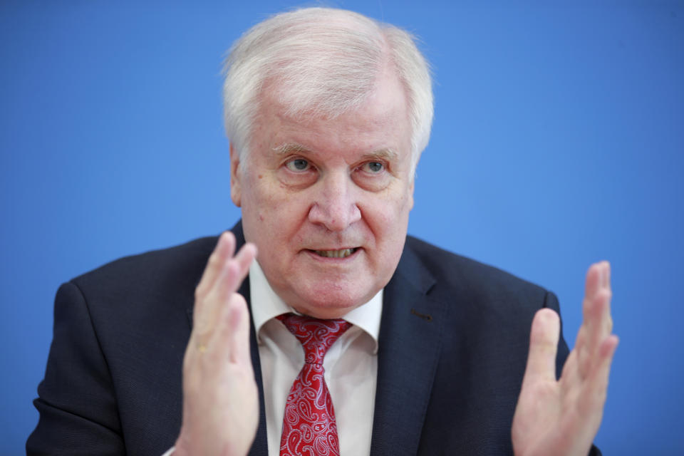 Horst Seehofer (CSU), Federal Minister of the Interior, Homeland and Construction, presents the 2019 Report on the Protection of the Constitution at the Federal Press Conference in Berlin, Germany, Thursday, July 9 2020. (Hannibal Hanschke/Pool via AP)