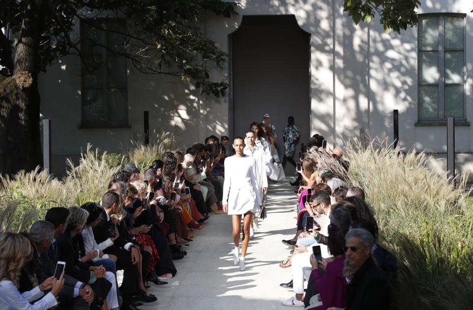 Models wear creations as part of the Salvatore Ferragamo Spring-Summer 2020 collection, unveiled during the fashion week, in Milan, Italy, Saturday, Sept. 21, 2019. (AP Photo/Antonio Calanni)