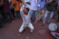 A supporter of Shiv Sena (Uddhav Balasaheb Thackeray) dances as he celebrates with others their party's lead during the counting of votes in India's national election in Mumbai, India, Tuesday, June 4, 2024. (AP Photo/Rafiq Maqbool)