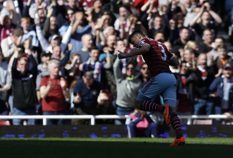 West Ham United's Aaron Cresswell celebrates after scoring during the Premier League match against Stoke City at Upton Park on April 11, 2015