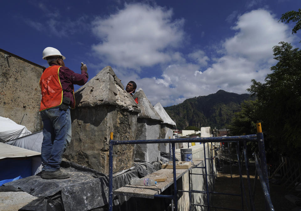 Restorers work on the 1550s-era convent of Tepoztlan in Morelos state, Mexico, Friday, Oct. 7, 2022. Indigenous symbols were found painted next to Roman Catholic motifs at this convent near Mexico City. (AP Photo/Marco Ugarte)