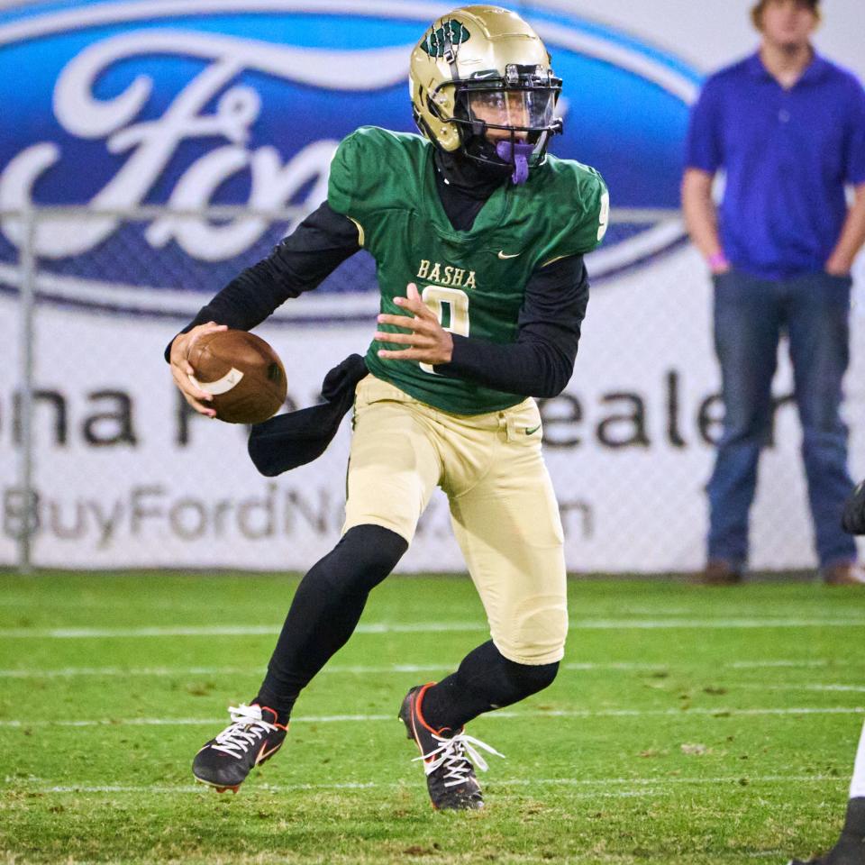 Basha Bears quarterback Demond Williams Jr. (9) rushes the ball against the Saguaro Sabercats during the Open Division state championship game at Sun Devil Stadium in Tempe on Dec. 10, 2022.