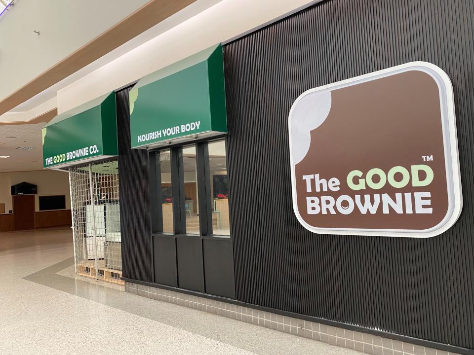 The long-time home of Just Cookies in Washington Square Mall has new signage, but the storefront is still empty.