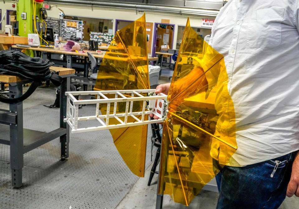 In Brown's engineering school lab, SBUDNIC's chief engineer, Marco Cross, shows a model of the device, built for about $10,000 using commonly available materials.