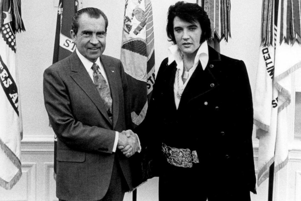 President Richard Nixon meets with Elvis Presley 21 December, 1970 at the White House. (Photo by National Archives)