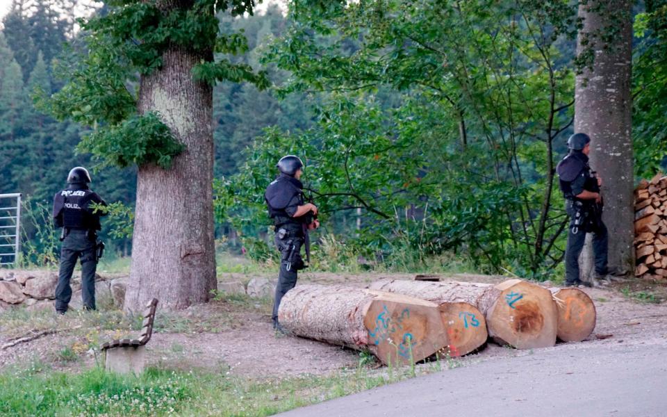 Authorities in Germany say they have deployed hundreds of police in the hunt for a 31-year-old man who disarmed four officers at gunpoint on Sunday - Sven Kohls/DPA