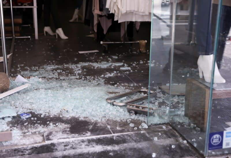 Damaged and boarded up storefronts are seen after protests against the death in Minneapolis police custody of George Floyd, in Manhattan